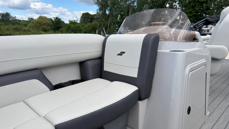 Slide: The Image of The image shows the cockpit of a Starcraft EX 20 Q DH boat with comfortable seating. - 22