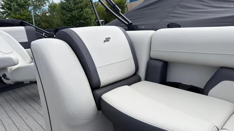 Slide: The Image of The 2027 Starcraft EX 20 Q DH features sleek white and gray seating. - 15