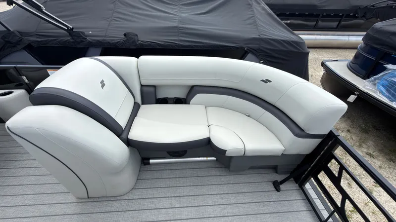 Slide: The Image of The image shows a white cushioned seating area on a boat, surrounded by gray flooring. - 10