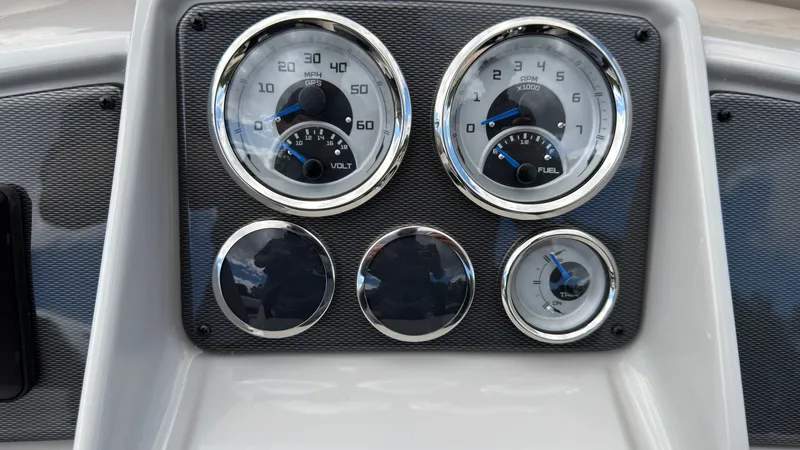 Slide: The Image of Dashboard with speedometer, tachometer, and fuel gauge in a modern boat. - 34