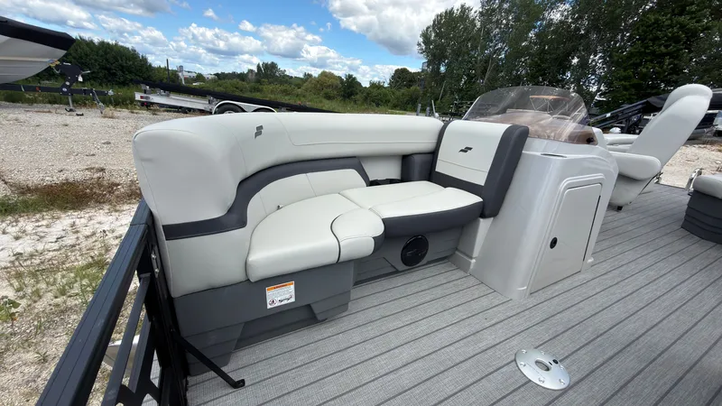 Slide: The Image of The image shows the deck of a Starcraft EX 20 Q DH boat with comfortable seating. - 8