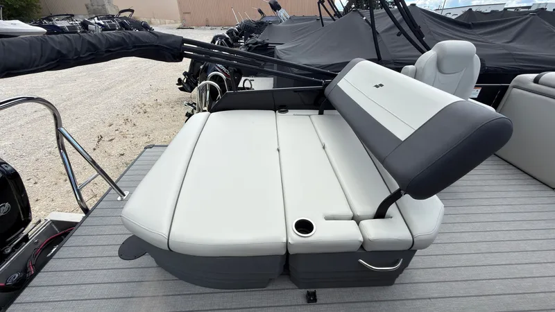 Slide: The Image of The image shows the seating area of a Starcraft EX 20 Q DH boat with gray upholstery. - 45