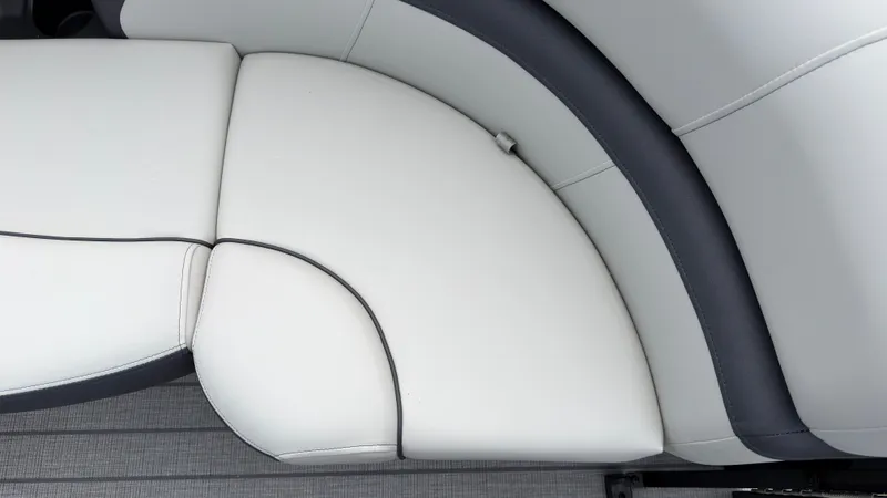 Slide: The Image of Close-up of a white and gray boat seat with sleek stitching. - 11