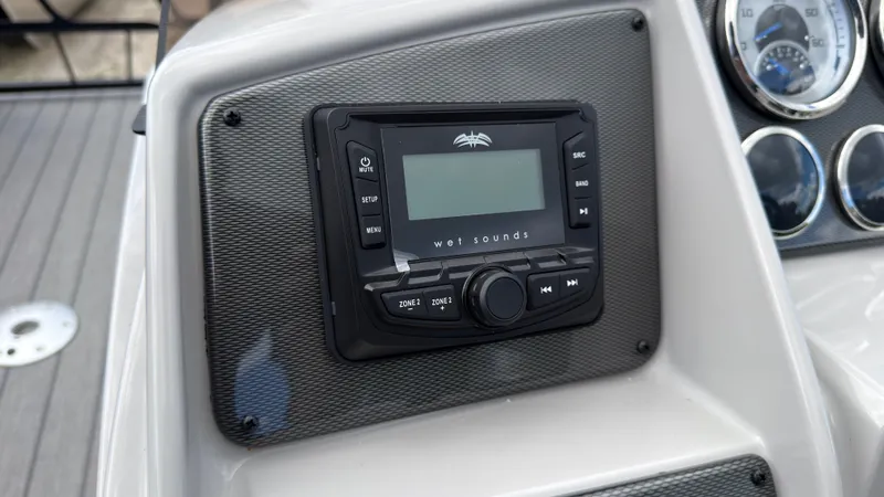 Slide: The Image of The image shows a modern audio system on a boat, surrounded by instruments and a textured panel. - 33
