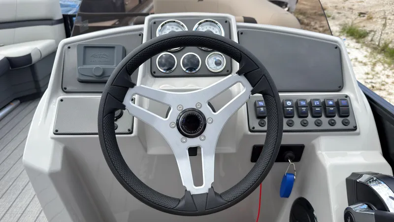 Slide: The Image of The image shows the helm of a Starcraft EX 20 Q DH boat with modern instruments. - 36