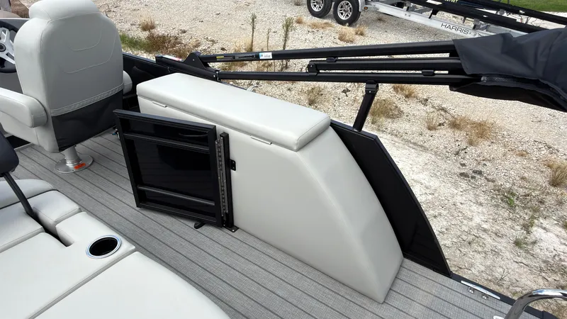 Slide: The Image of The image shows the interior of a 2027 Starcraft EX 20 Q DH boat with seating and storage. - 48