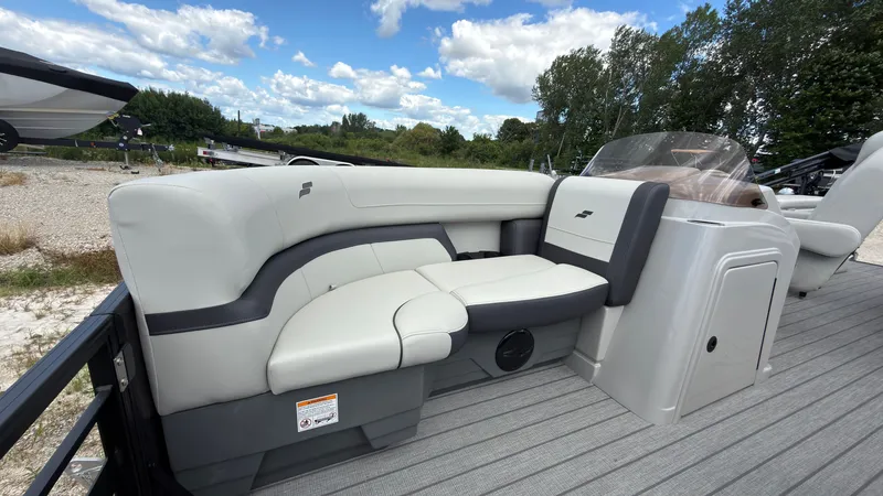 Slide: The Image of The image shows the cockpit of a Starcraft EX 20 Q DH with gray upholstery and a helm station. - 16