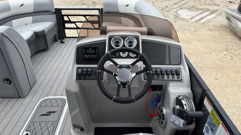 Slide: The Image of The image shows the cockpit of a 2027 Starcraft EXS 3 DL boat with a modern helm. - 37
