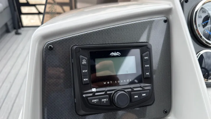 Slide: The Image of The image shows a modern audio system on a boat, surrounded by a gray dashboard. - 39