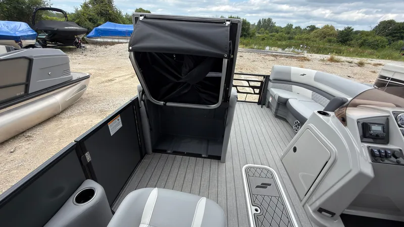 Slide: The Image of The image shows the interior of a 2027 Starcraft EXS 3 DL boat with gray seating. - 30