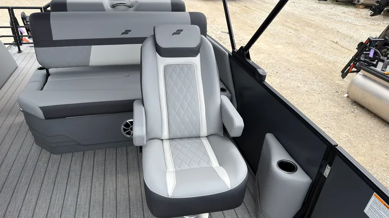Slide: The Image of The image shows the interior of a 2027 Starcraft EXS 3 DL with gray upholstery and modern seating. - 34