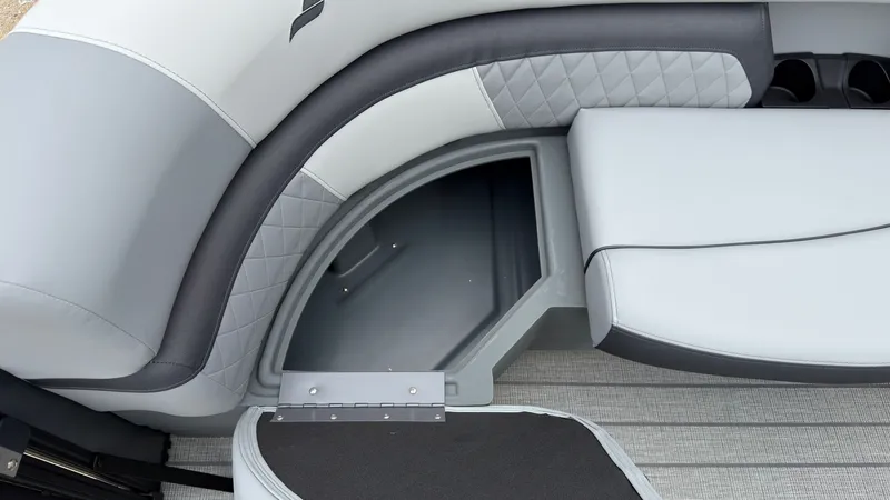 Slide: The Image of The image shows a gray seating area with storage underneath on a boat. - 18