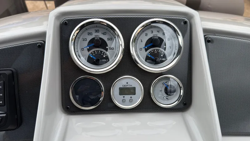 Slide: The Image of Dashboard of a 2027 Starcraft EXS 3 DL with speedometer and fuel gauge. - 41