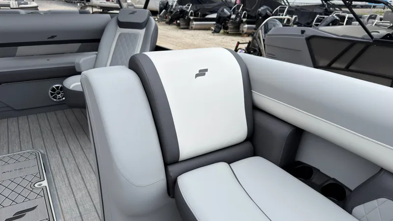 Slide: The Image of The image shows the interior of a 2027 Starcraft EXS 3 DL with gray and white seating. - 15