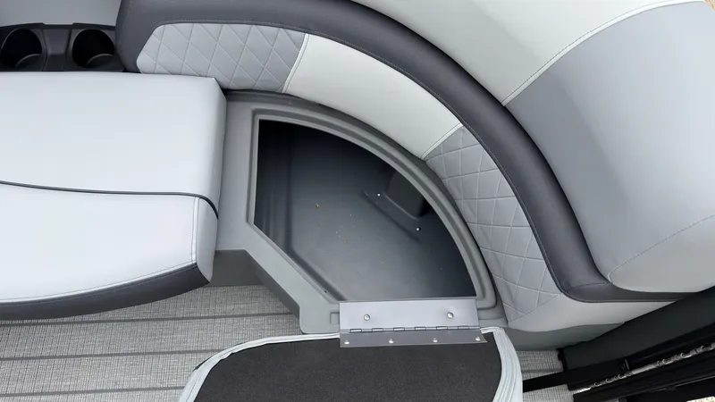 Slide: The Image of The image shows a gray and white bench seat with storage space underneath. - 12