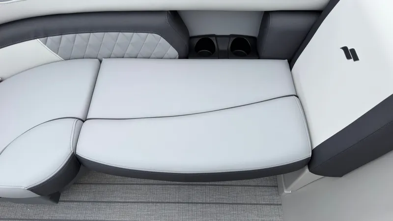 Slide: The Image of The image shows a gray and white bench seat with two cup holders. - 19