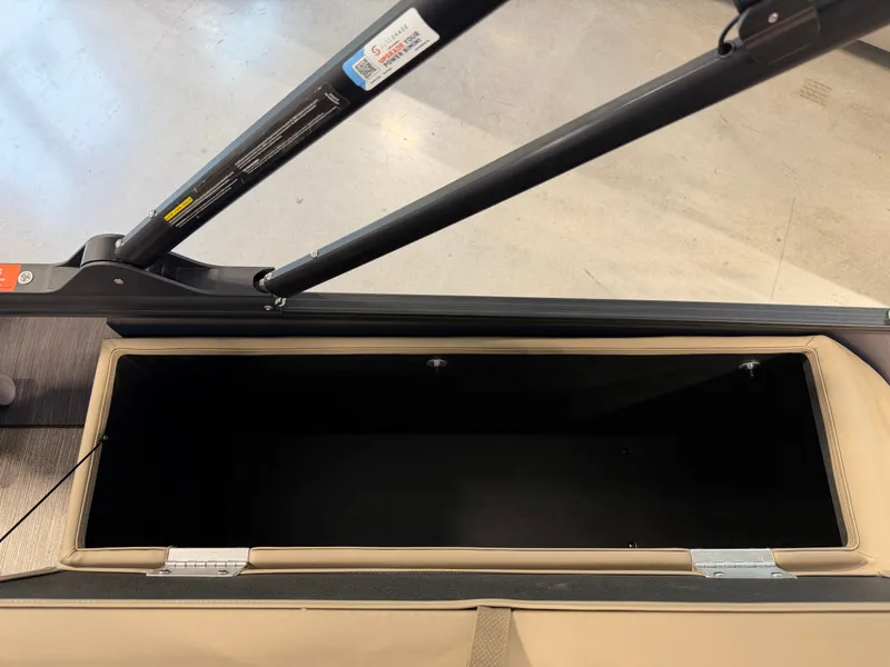 Slide: The Image of An open storage compartment on a 2026 Sylvan MIRAGE X1 CLZ DH boat. - 28