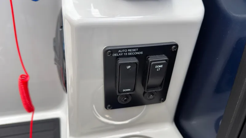 Slide: The Image of Close-up of switches on a boat panel, including "Auto Reset" and "Dome Lt." - 41