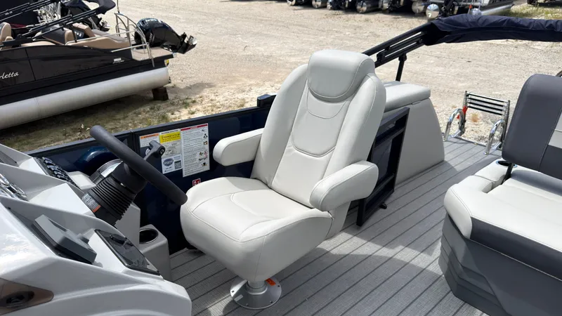Slide: The Image of The 2027 Starcraft EX 20 Q DH features a comfortable captain's chair and a modern helm. - 34