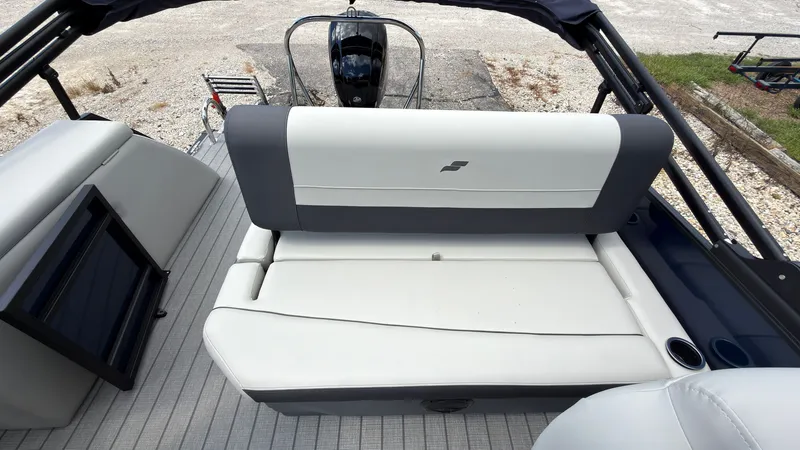Slide: The Image of The image shows the stern of a Starcraft EX 20 Q DH boat with a cushioned bench seat. - 43