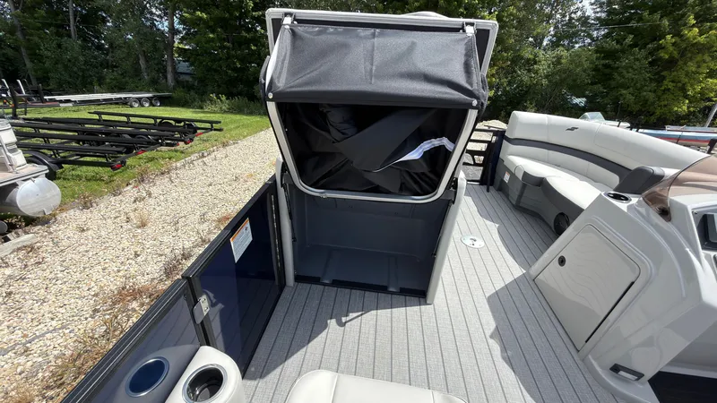 Slide: The Image of The image shows the deck of a 2027 Starcraft EX 20 Q DH with seating and storage. - 31