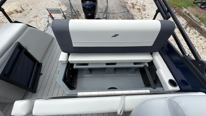 Slide: The Image of The image shows the stern of a Starcraft EX 20 Q DH boat with gray and white seating. - 44