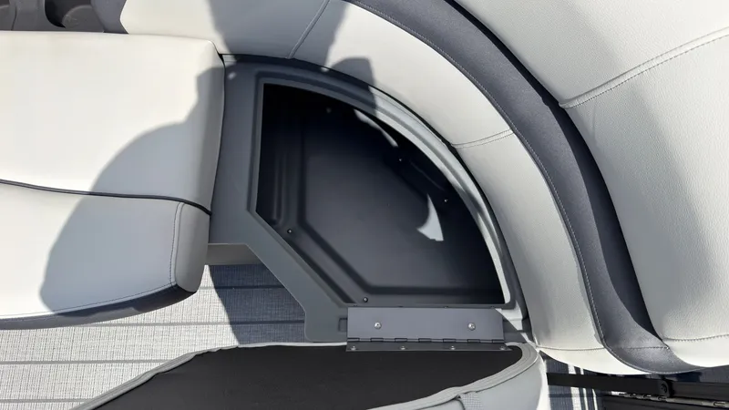 Slide: The Image of The image shows a seating area with gray upholstery and an open storage compartment beneath. - 19