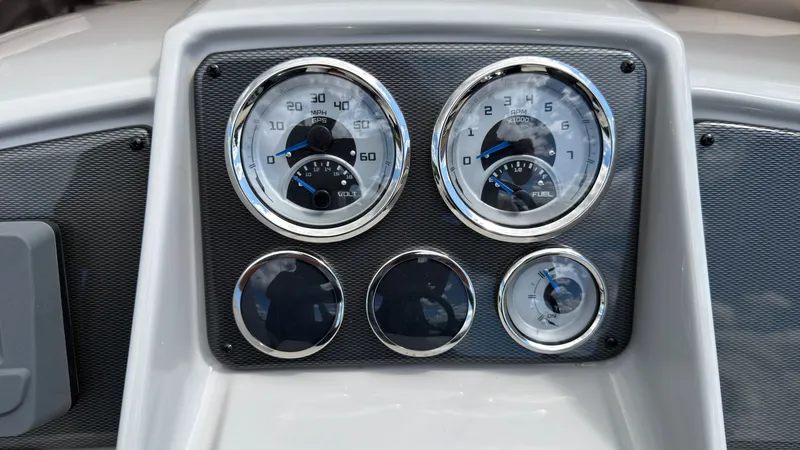 Slide: The Image of Dashboard of a Starcraft EX 20 Q DH with speedometer and fuel gauge. - 37
