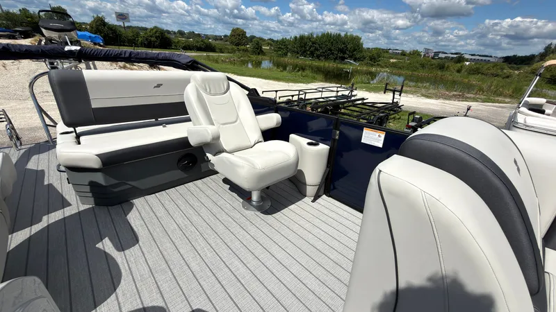Slide: The Image of The image shows the deck of a 2027 Starcraft EX 20 Q DH boat with white seating. - 27