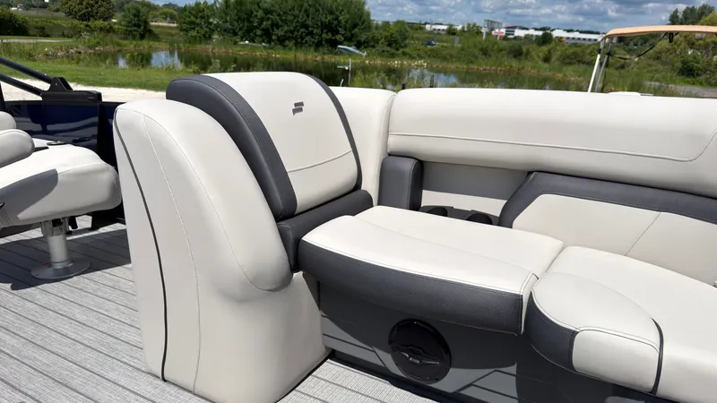 Slide: The Image of The image shows the luxurious seating of a 2027 Starcraft EX 20 Q DH boat. - 23