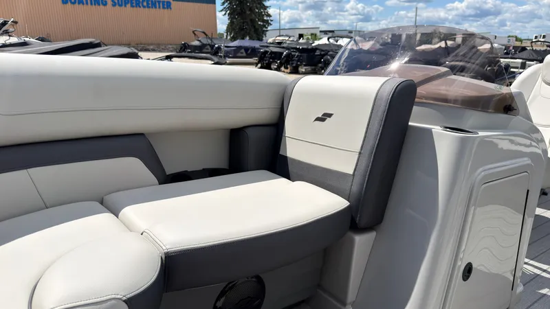 Slide: The Image of The image shows the interior of a Starcraft EX 20 Q DH boat with beige and gray seating. - 16