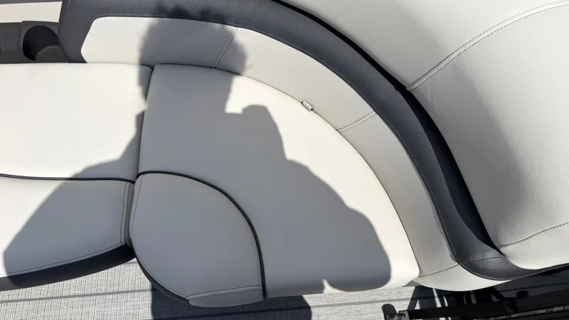 Slide: The Image of Close-up of a white boat seat with gray accents. - 18