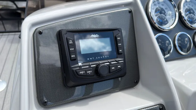 Slide: The Image of The image shows a modern boat panel with a Wet Sounds audio system and several instrument gauges. - 36