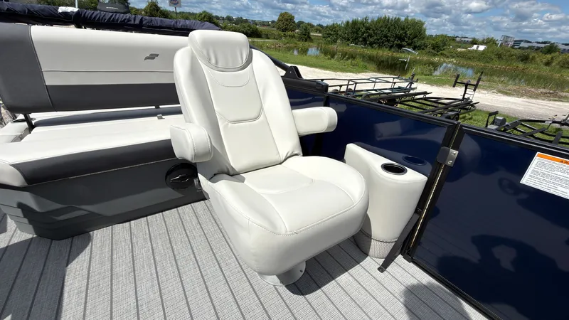 Slide: The Image of The image shows the seating area of a 2027 Starcraft EX 20 Q DH boat with comfortable white seats. - 28