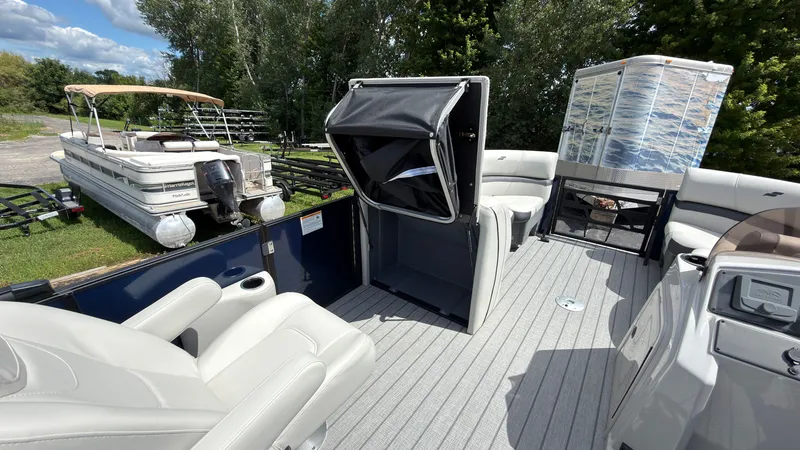Slide: The Image of The image shows the deck of a 2027 Starcraft EX 20 Q DH with comfortable seating and an open storage area. - 30