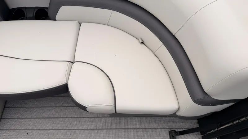 Slide: The Image of The image shows the sleek, upholstered seating of a Starcraft EX 20 Q DH boat. - 12