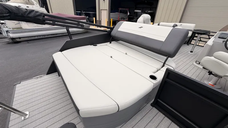 Slide: The Image of The image shows the stern of a 2027 Starcraft EX 20 Q DH boat with gray and white upholstery. - 47