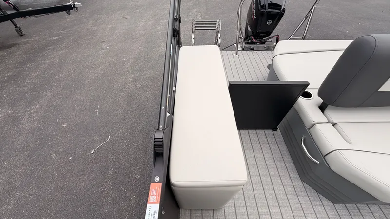 Slide: The Image of The image shows the stern of a Starcraft EX 20 Q DH boat with gray upholstery. - 43
