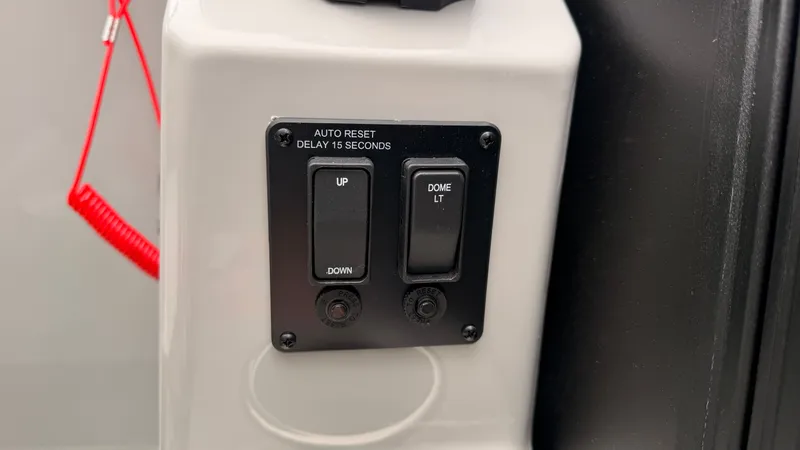 Slide: The Image of Close-up of a control panel with switches for "Up/Down" and "Dome LT." - 40