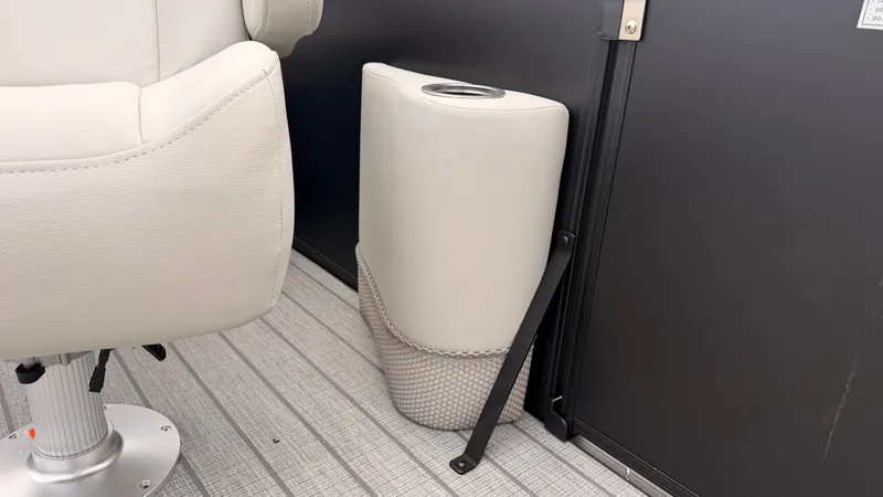 Slide: The Image of Interior of a 2027 Starcraft EX 20 Q DH with a white seat and a cup holder. - 30