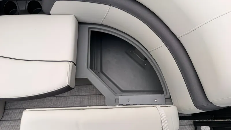 Slide: The Image of The image shows a gray and white bench seat with an open storage compartment underneath. - 13