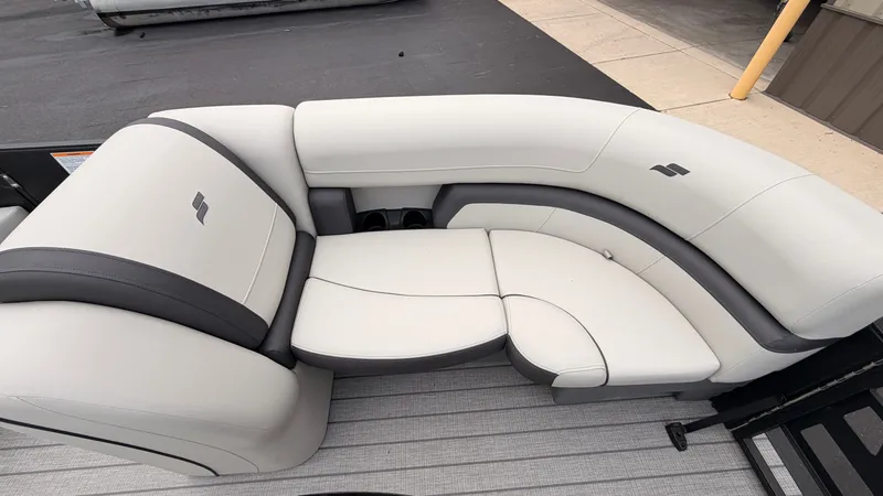 Slide: The Image of The image shows a sleek, white seating area on a boat, featuring gray accents and a modern design. - 11