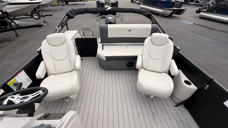 Slide: The Image of The image shows the cockpit of a 2027 Starcraft EX 20 Q DH with comfortable seating. - 25