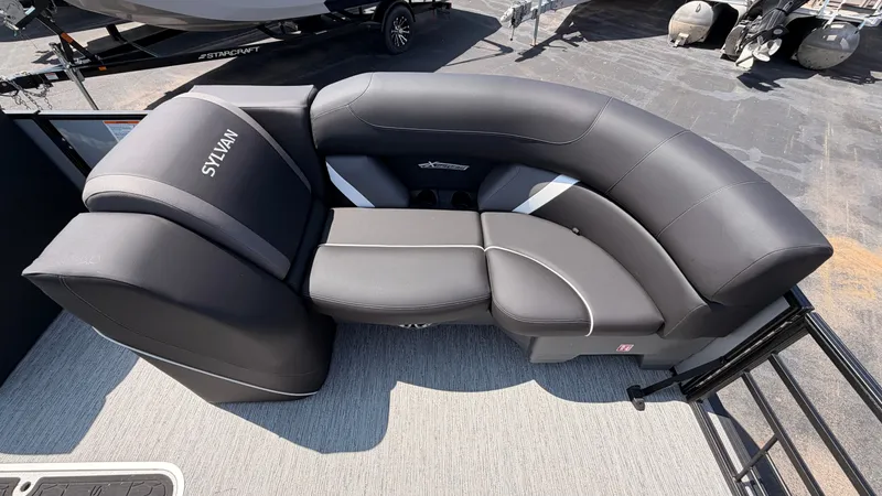 Slide: The Image of The image shows a luxurious, cushioned seating area on a Sylvan boat. - 10