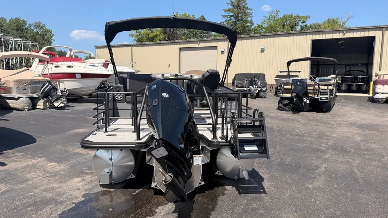 Slide: The Image of Sylvan MIRAGE X3 DLZ BAR 2026 on a lot with other boats. - 6