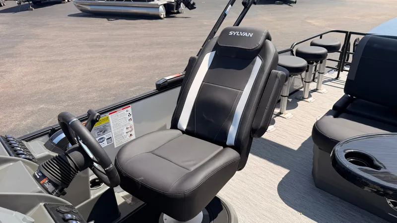 Slide: The Image of The 2026 Sylvan MIRAGE X3 DLZ BAR features a sleek captain's chair and modern helm console. - 42