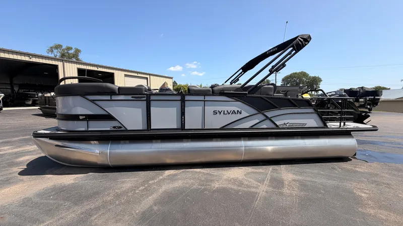 Slide: The Image of A modern pontoon boat with a gray and black design, featuring a sunshade and comfortable seating. - 4