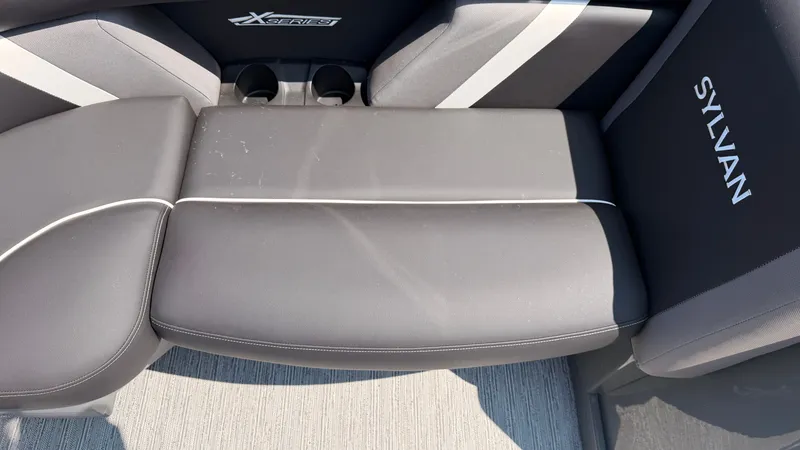 Slide: The Image of The interior of the Sylvan MIRAGE X3 DLZ BAR features a cushioned bench seat with cup holders. - 19