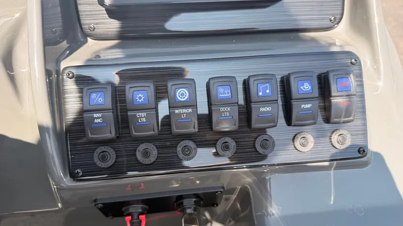 Slide: The Image of The image shows a control panel with various switches for navigation lights, interior lighting, and more. - 36