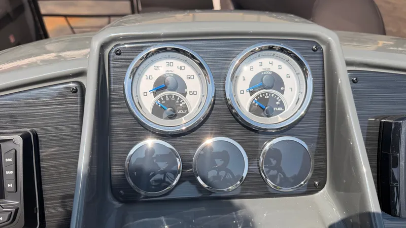 Slide: The Image of Close-up of a Sylvan MIRAGE X3 DLZ BAR dashboard with speedometer and fuel gauge. - 34